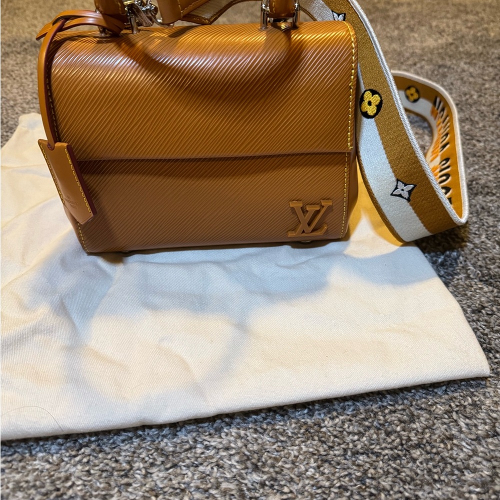 Louis Vuitton cluny mini bag Epi leather with silver hardware.